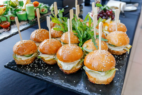 Elegant Mini Sandwiches and Canaps on a Dark Platter