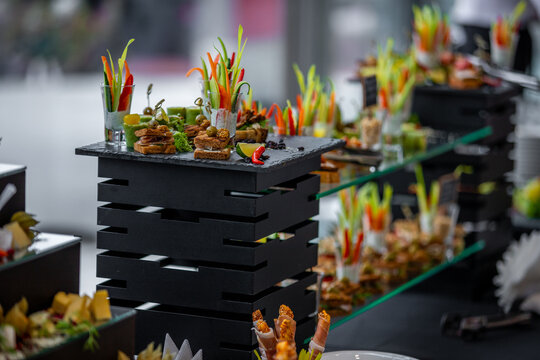 Elegant Mini Sandwiches and Canaps on a Dark Platter