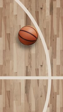 Top View Basketball on Hardwood Court with Curved Three Point Line and Copy Space