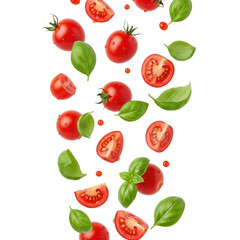 Naklejka premium Fresh tomatoes and basil leaves falling in air