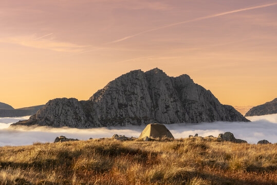 Wonderful camping scene with a tent above a cloud inversion weather in Snowdonia, UK