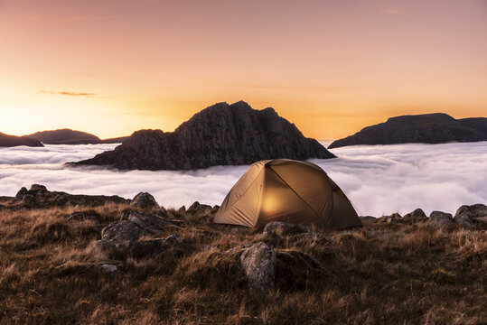 Wonderful camping scene with a tent above a cloud inversion weather in Snowdonia, UK