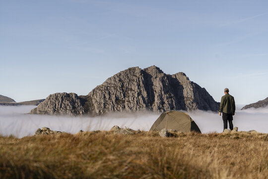 Incredible camping scene in the mountains of Snowdonia, Wales, with Tryfan