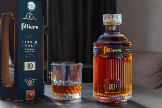 Bottle of Filliers 10 Year Old Sherry Oak Casks Belgian Single Malt Whisky with its original box and crystal glass on dark table. Premium spirits photography. Ukraine, Zhytomyr, February 11, 2026