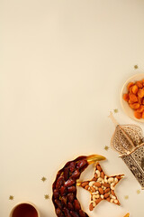 Ramadan celebration vertical background with traditional lantern, dates, nuts, tea, and festive decorations ,