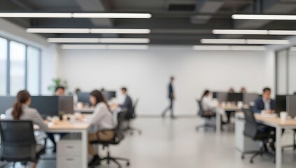 Fototapeta premium Abstract blurred background of modern office with people working at their desks