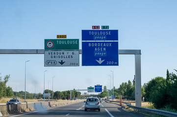 Highway car journey on A20-E9 route through central and southern France, connecting major cities: Vierzon, Limoges, Brive, Cahors, Montauban, Toulouse, diverse road signs