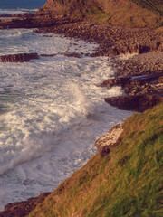 Stunning coast of Mullaghmore Peninsula in county Sligo, Ireland. Amazing nature scenery with powerful ocean and picturesque coast line with rough stone cliff. Popular tourist area.