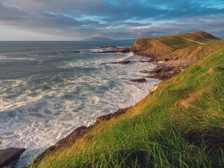 Stunning coast of Mullaghmore Peninsula in county Sligo, Ireland. Amazing nature scenery with powerful ocean and picturesque coast line with rough stone cliff. Popular tourist area.