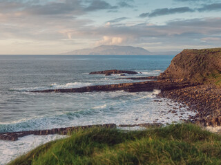 Stunning coast of Mullaghmore Peninsula in county Sligo, Ireland. Amazing nature scenery with powerful ocean and picturesque coast line with rough stone cliff. Popular tourist area.