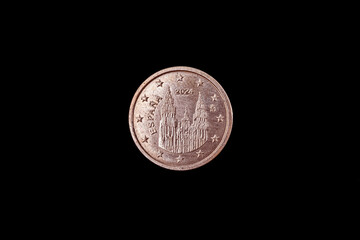 Spanish 1 cent euro coin featuring the Obradoiro fa&ccedil;ade of the Cathedral of Santiago de Compostela. The worn metal surface shows the Romanesque and Baroque architecture of this pilgrimage site.