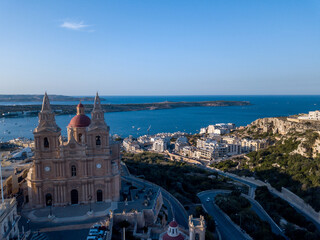Obraz premium Aerial View of Mellieħa with Church and Town, Malta