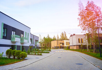Townhouses in gated community. Norwegian Apartment Block. Scandinavian townhouse. Two-story Modern townhome building in Scenic District. Street with Duplex in Norway. Modern townhouse in forest. © MaxSafaniuk
