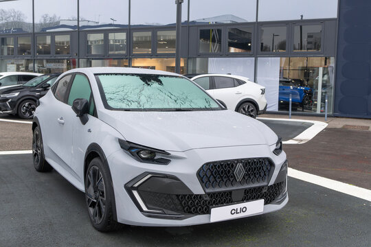 Laxou, France - January 30th 2026 : View on a grey Renault Clio VI with the windshield frozen finished in Rafale Grey parked on a parking lot.