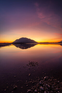 Vertical Fraser River Sunset Reflection with Mountain Silhouette in Chilliwack British Columbia Canada