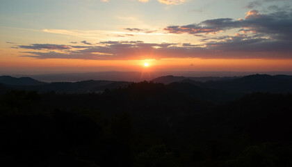 Naklejka premium Golden evening above jungle hills