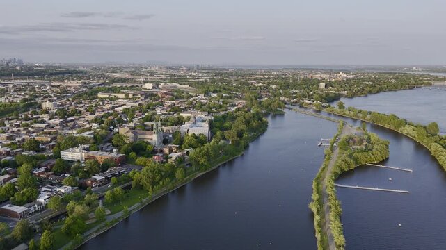 Aerial view of Rene-Levesque Park lighthouse peninsula in Lachine, Montreal along St Lawrence River at sunset. g.