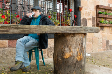 Senior man drinking water for hydration and health