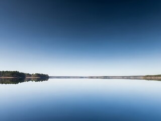 Serene lake reflection, calm water, blue sky landscape