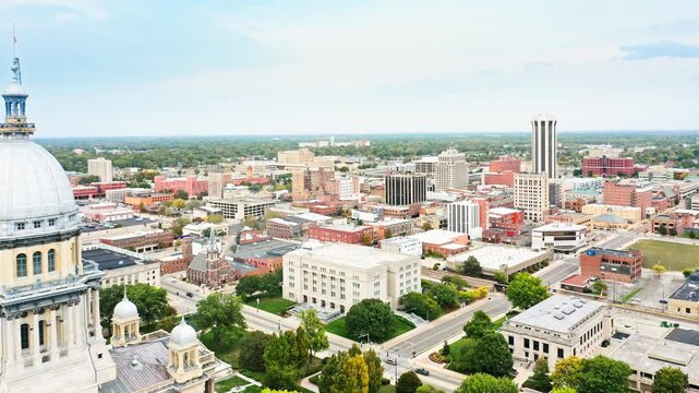 Revealing shot of Springfield and Illinois State Capitol. The Illinois State Capitol, in Springfield, Illinois, houses the legislative and executive branches of the government of the State of Illinois