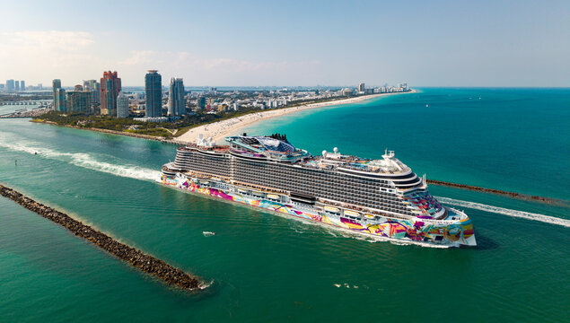 Miami, Florida, USA - April 16, 2025: Ship leaving Miami port. NCL. Norwegian Aqua cruise ship voyage. Cruise in summer vacation. Norwegian cruise line. Cruise ship tour and travel at sea