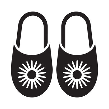 Black and white illustration of a pair of traditional babouche slippers