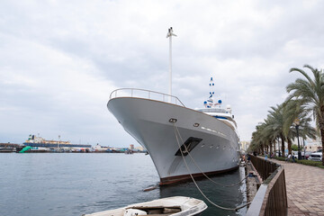 Modern luxury yacht moored at Sharjah waterfront. Elegant marina scene reflecting upscale lifestyle, coastal living, and premium travel in the UAE.