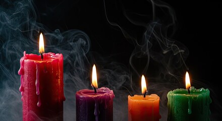 Lit candles in various colors with smoke against a dark background
