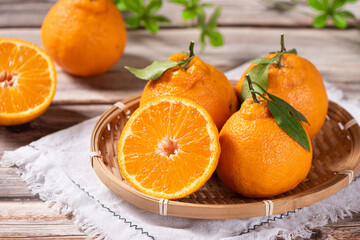 fresh ponkans tangerines on wooden table.