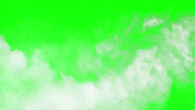 Wispy white smoke elegantly drifts across a vibrant chroma key green screen background creating an atmospheric special effect overlay for video production needs