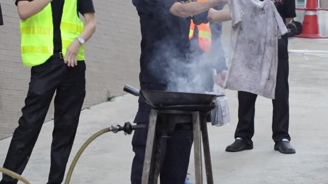 Fire extinguisher fire training safety drill with firefighter instructor, smoke demo, fire pan control, fire blanket use, outdoor emergency program