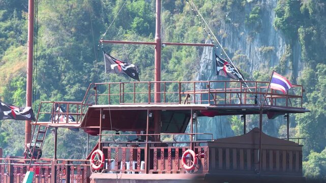 Pirate Ship with Jolly Roger and Thai Flags in Phi Phi Islands