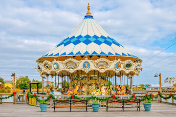 Colorful wooden carved horses and other animals on the waterfront boardwalk carousel in Myrtle Beach, South Carolina. © Kirk Fisher