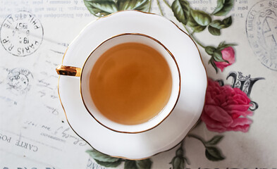 Elegant Tea Cup Top View on Vintage Floral Background, Cozy Tea Time