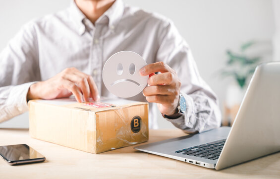 Survey highlights customer experience feedback, showing dissatisfaction with online shopping delivery service, person holds sad face near damaged box, impacting business reputation concept