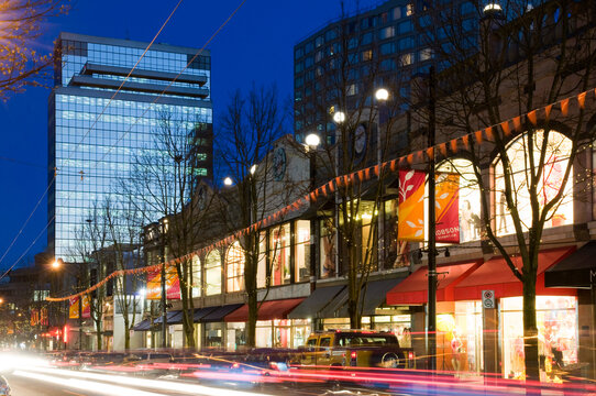 Canada, BC, Vancouver.  Robson Street at night.