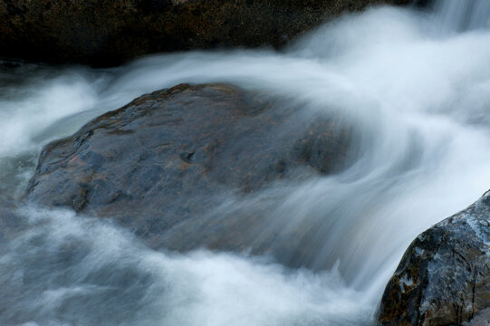 Canada, BC, Keremeos.  Water rushing over the stones in the Ashnola River