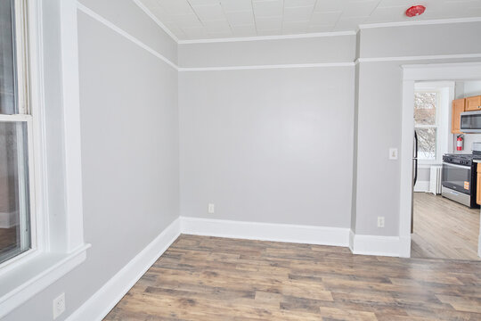 Empty apartment interior painted grey with pretty woodwork