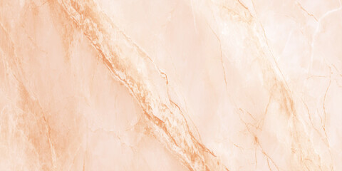 Fototapeta premium A close up view of a textured light peach and cream colored marble surface with subtle veining patterns