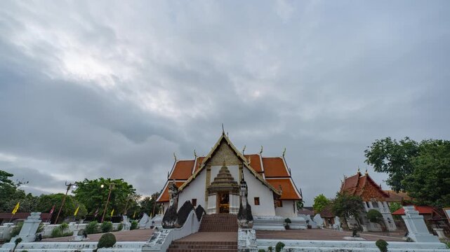 Historic Wat Phumin temple showcases traditional Lanna wall paintings known as Hub Taem, depicting ancient northern Thai life and culture. The renowned Whispering Lovers mural is a symbol of Nan
