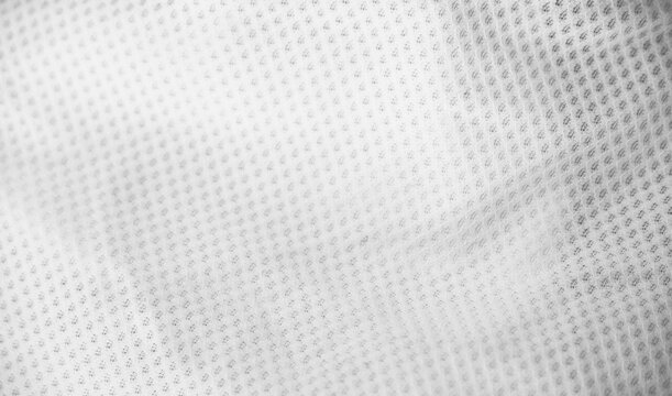 White fabric sport clothing football jersey with air mesh texture background