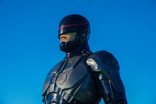 a Robocop statue at the Tangga Arung traditional market, Tenggarong with blue sky