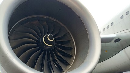 Close-up of airplane turbofan engine with fan blades, showcasing precision engineering, aerodynamic design, and advanced aviation technology 