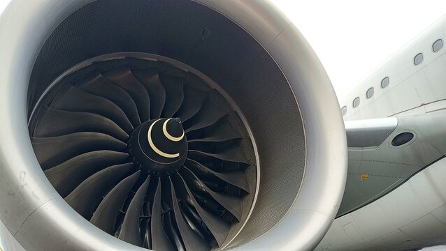 Close-up of airplane turbofan engine with fan blades, showcasing precision engineering, aerodynamic design, and advanced aviation technology	