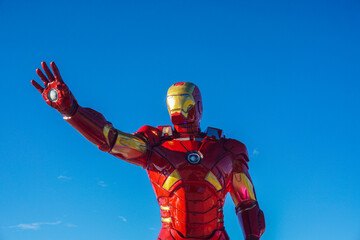 Naklejka premium an iron man statue at the traditional market of Tangga Arung, Tenggarong with blue sky