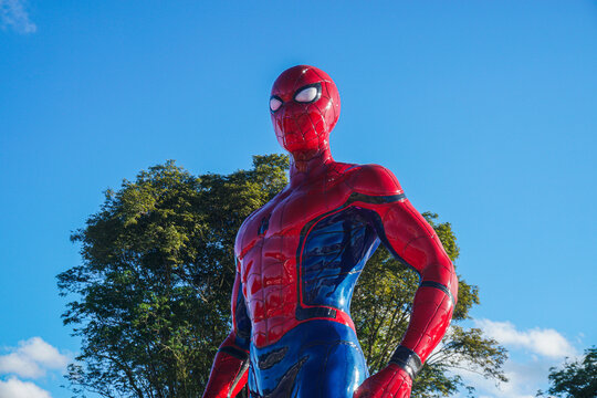 a spiderman statue at the traditional market of Tangga Arung, Tenggarong with blue sky