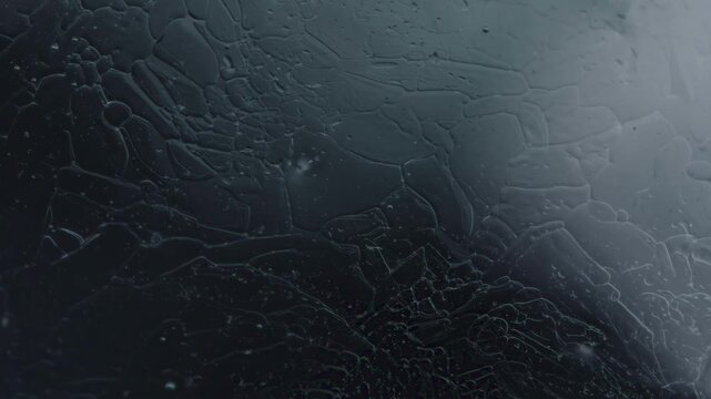 Abstract dark textured background with intricate patterns and subtle highlights