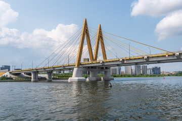 Obraz premium The Millennium Bridge over the Kazanka River on a summer day.