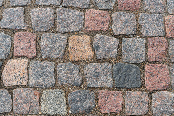 Obraz premium Stone block pavement in the rays of the setting sun. Texture
