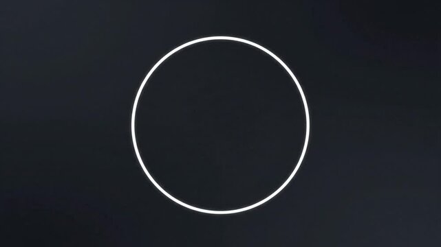 Simple white circle on a black and white background with a minimalist design composition.
